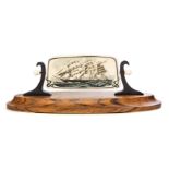 A Scrimshaw Fossil Mammoth Ivory Plaque   julius cohen   depicting a clipper ship, mounted in a