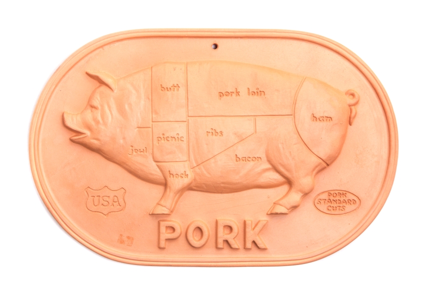 * A Brique Ware Plaque   showing a diagram of pork cuts.   Width 12 1/4 inches.   Estimate $   30-50