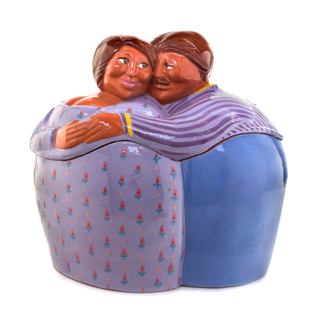 A Little & Co. Ceramic Jar and Cover   in the form of two figures embracing.   Height 12 inches.