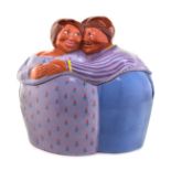 A Little & Co. Ceramic Jar and Cover   in the form of two figures embracing.   Height 12 inches.