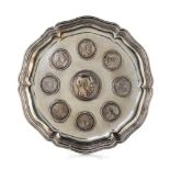 A German Silver Tray   19th/20th Century   of shaped circular form, inset with eight 19th and 20th