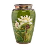 * A Sevres Enameled Ceramic Vase   20th century   decorated with lotus on a green ground.   Height