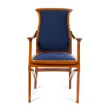 * An Art Nouveau Walnut Fauteuil   henry van de velde, circa 1901   the shaped padded back flanked