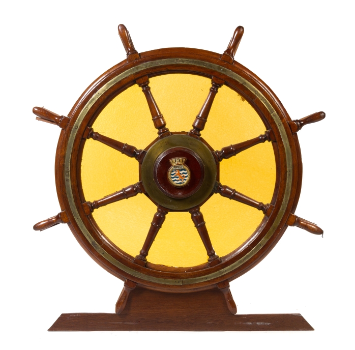 * An Ornamental Brass Mounted Oak Ship's Wheel   the handles joining stained glass panels