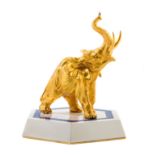 * A Vermeil Animalier Figure   fred paris, 1992   depicting a standing elephant with trunk raised,