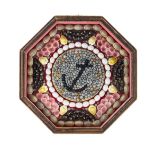 * A Framed Sailor's Valentine   of octagonal form, signed Bernard A. Woodman and numbered 200.