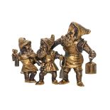 A Continental Bronze Figural Group   19th/20th century   depicting three gnomes carrying lanterns,