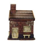 * An English Gilt Metal Mounted Oak Humidor   20th century   in the form of a cottage with a