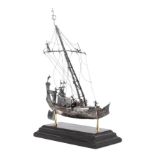 * A Silver Model of a Chinese Junk   applied with figures and realistic riggings, raised on a