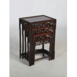 A quartetto of Chinese dark wood occasional tables, late 19th/ early 20th century, the panelled