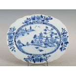 A Chinese porcelain blue and white oval-shaped meat plate, Qing Dynasty, decorated with pavilions,
