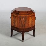 A 19th century mahogany and boxwood lined octagonal shaped wine cooler, the hinged top opening to