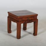 A Chinese dark wood jardiniere stand/ occasional table, the square panelled top above a shallow