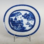 A Chinese porcelain blue and white oval-shaped dish, Qing Dynasty, decorated with pavilions and