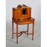 An early 20th century satinwood and boxwood lined bonheur-de-jour, the rectangular top with