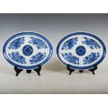 A pair of Chinese porcelain oval-shaped dishes, Qing Dynasty, decorated in the Fitzhugh pattern with