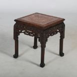 A Chinese dark wood jardiniere stand, Qing Dynasty, the square top with a mottled red and white