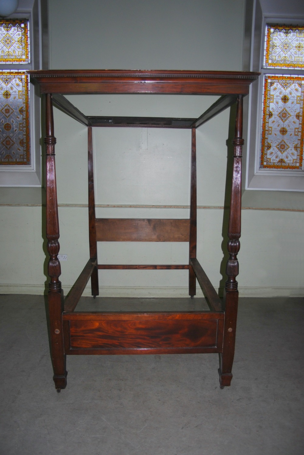 A late 19th century mahogany four poster single bed, the canopy with a moulded edge and dentil - Image 2 of 7