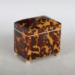 A 19th century tortoiseshell tea caddy, the hinged domed cover centred with a rectangular white