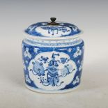 A Chinese porcelain blue and white bowl and cover, Qing Dynasty, decorated with two shaped panels
