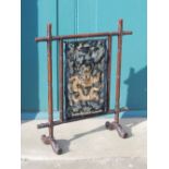 A Chinese dark wood screen, late 19th/ early 20th century, the bamboo carved frame enclosing a