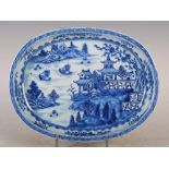 A Chinese porcelain blue and white oval-shaped dish, Qing Dynasty, decorated with pavilions and