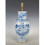A Chinese porcelain blue and white vase, Qing Dynasty, decorated with two dragons and peony within