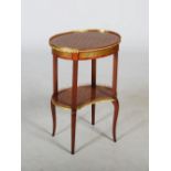 An early 20th century kingwood, parquetry inlaid and gilt metal mounted occasional table, the oval