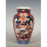 A Japanese Imari vase, of lobbed form decorated with panels of flowering trees, 23.5cm high