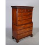 A George III mahogany chest on chest, the moulded cornice and arcaded frieze above two short and