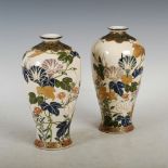 A pair of Japanese Satsuma pottery vases, Meiji Period, decorated with enamelled flowers and foliage