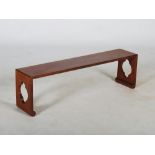 A Chinese dark wood bench, 20th century, of plain rectangular form with pierced quartrefoil