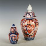 Two Japanese Imari jars and covers, both of lobbed form decorated with panels of flowers and