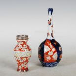 Two Japanese Imari vases, to include; a bottle vase, 15.5cm high, and a small white metal mounted