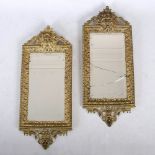 A pair of late 19th/ early 20th century gilt metal mirrors, the bevelled rectangular mirror plates