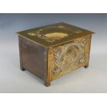 A Scottish Arts & Crafts brass log box, decorated with embossed oval panel bearing initial 'M' on