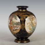 A Japanese Satsuma pottery blue ground vase, Meiji Period, decorated with four circular shaped