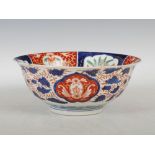 A late 19th/ early 20th century Japanese Imari bowl, the central roundel enclosing a green glazed