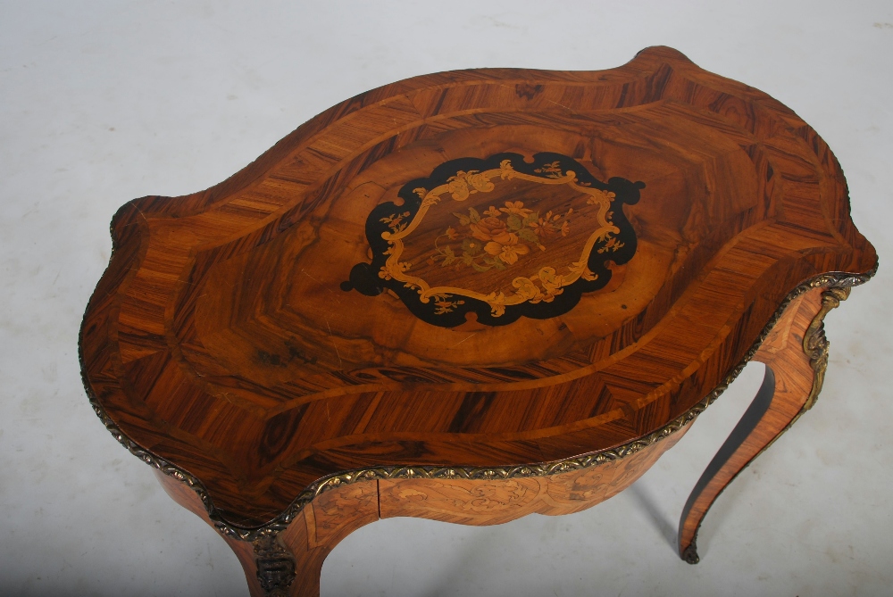 A late 19th century rosewood, marquetry and gilt metal mounted table, the shaped oval top - Image 3 of 4