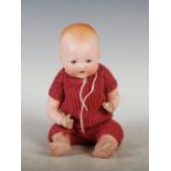 An early 20th century Armand Marseille bisque head baby doll, modelled as a baby with open and close