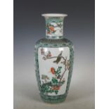 A Chinese porcelain famille verte vase, Kangxi six character mark but later, decorated with two