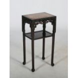 A Chinese dark wood jardiniere stand, Qing Dynasty, the rectangular top with a mottled red and white