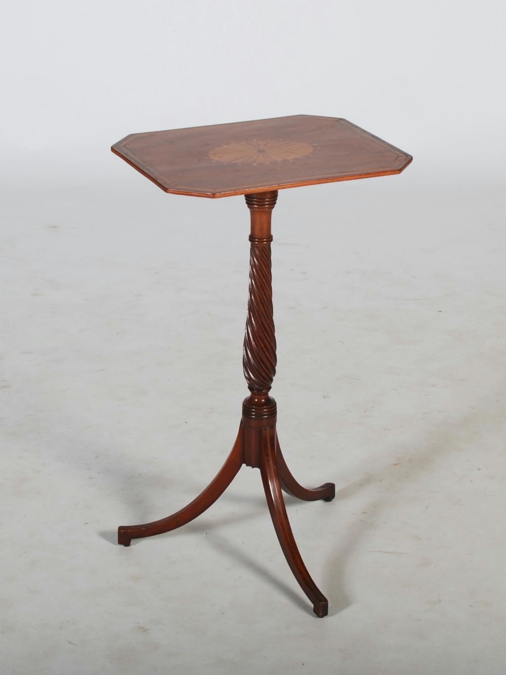 An Edwardian mahogany and satinwood banded occasional table, the octagonal top inlaid with oval