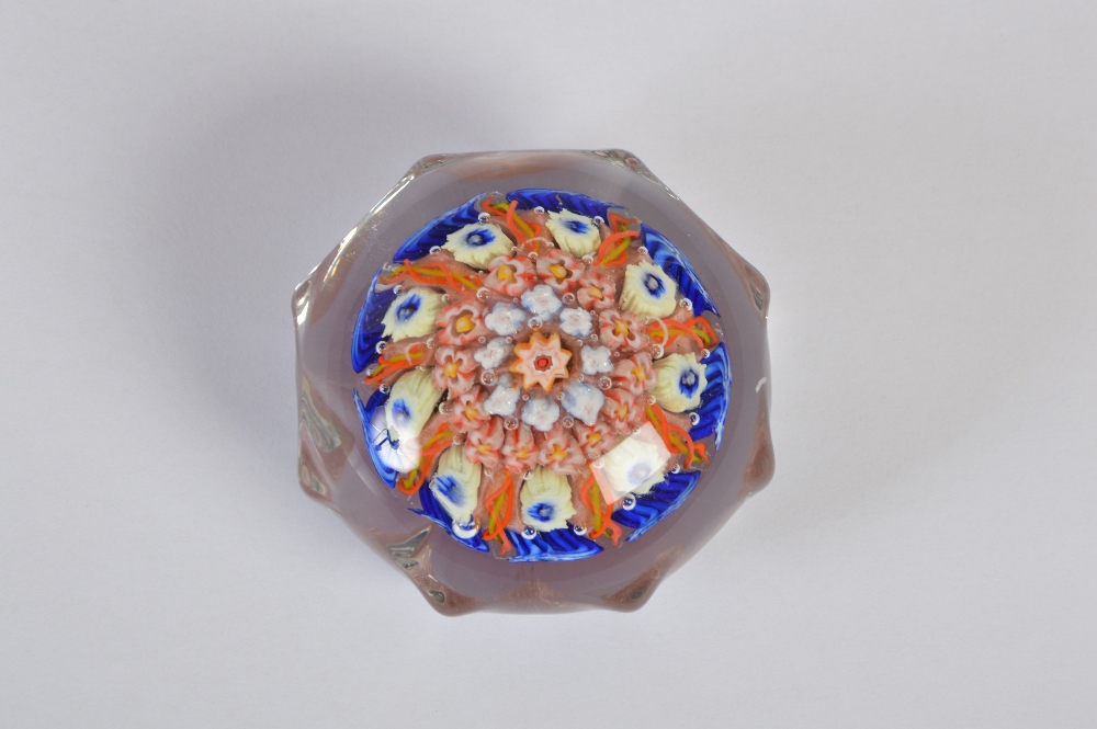 A Monart glass octagonal shaped millefiori paperweight, decorated with colourful canes, 7cm