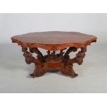 A good Victorian walnut and marquetry inlaid centre table, the shaped oval top with a moulded edge
