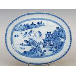 A Chinese porcelain blue and white oval-shaped dish, Qing Dynasty, decorated with pavilions in a