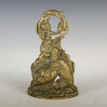 A brass doorstop, cast with a pair of birds, with pierced foliate scroll handle, 28cm high