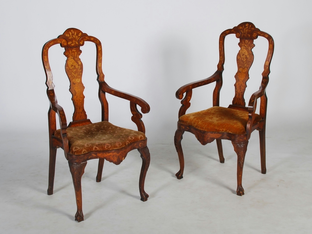 A pair of 18th/ 19th century Dutch mahogany and marquetry inlaid armchairs, the vase-shaped splats