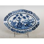 A Chinese porcelain blue and white oval-shaped dish, Qing Dynasty, decorated with rockwork, peony,