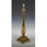 A late 19th century gilt metal table lamp, the baluster shaped column with acanthus cast collar,